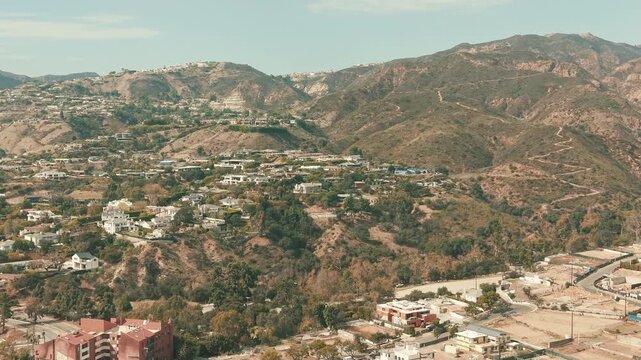 Drone panorama of Pacific Palisades hills and residential areas recovering after the wildfire.