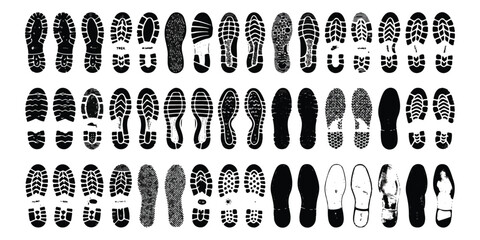 Obraz na płótnie Canvas Set of various black shoe tread patterns and footprints isolated on a flat surface