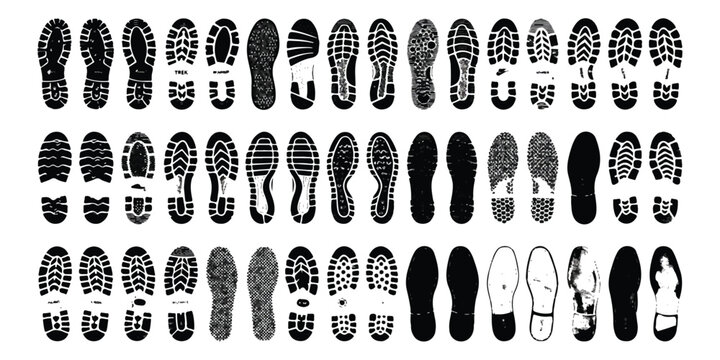 Set of various black shoe tread patterns and footprints isolated on a flat surface