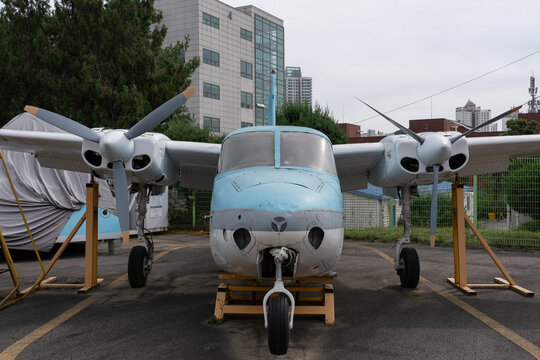South Korea - October 3, 2026: Front view of twin-engine propeller aircraft on display at aviation school.
