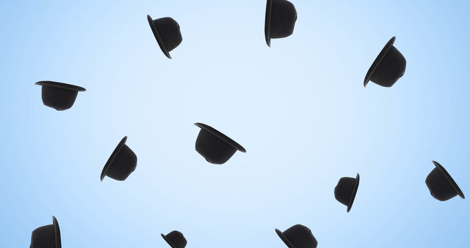 Image of black hats falling on blue background