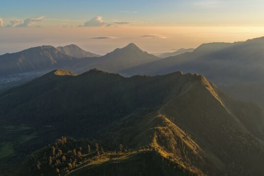 Stunning Sunrise View Over the Majestic Ridges of Bukit Pergasingan in Lombok, Indonesia