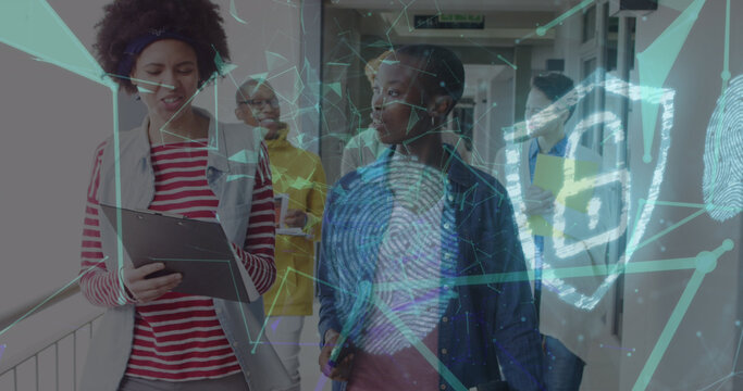 Image of network of connections with padlock icon over diverse business people in office