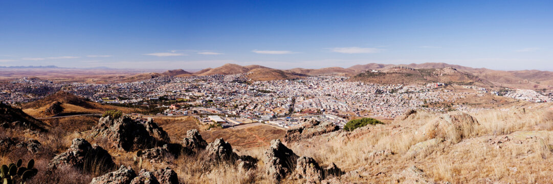 Panoramic cityscape of zacatecas with dry hills and rocky terrain