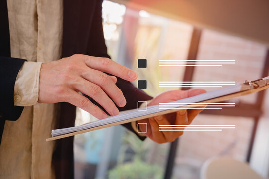 Businessman holding folder of documents in modern office in Business planning and investment financial data analytics graph Financial management technology concept.