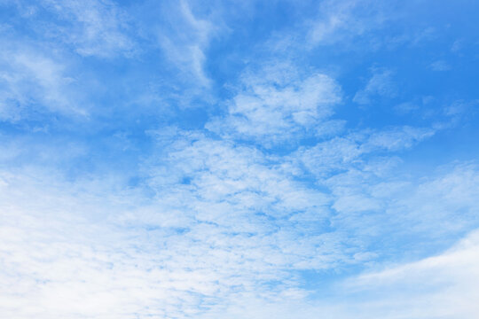 small clouds against blue sky, bright welkin in sunny weather