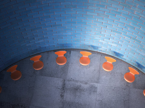 Chairs arranged in a circle in front of brick wall, 3D Rendering