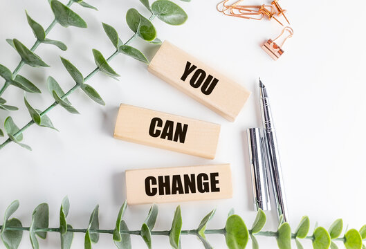 You can change motivational message with wooden blocks, green leaves and stationery, expressing personal growth