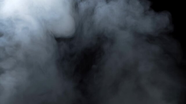 White smoke clouds billow and swirl across a black background. Cinematic title, horror production, and dramatic transitions.