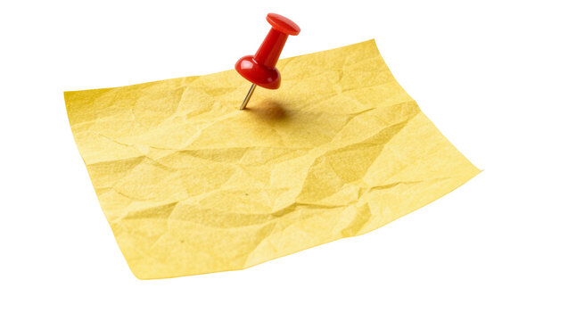 Crumpled yellow sticky note pinned with a red plastic push pin