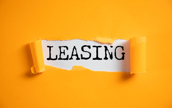 LEASING word on white paper