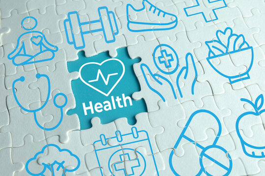 White jigsaw puzzle with blue medical and fitness icons. Missing center piece reveals a white heart shape with pulse line and the word Health. Concept of healthy lifestyle, medical care, and wellness.