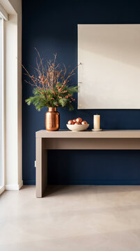 Navy wall console with copper vase, pine berry branches, copper baubles and blank canvas