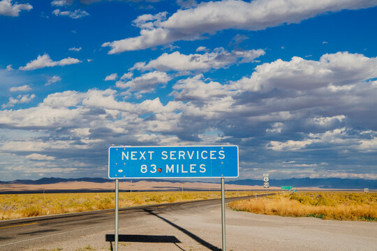 Road sign warning no services for 83 miles on Nevada desert highway