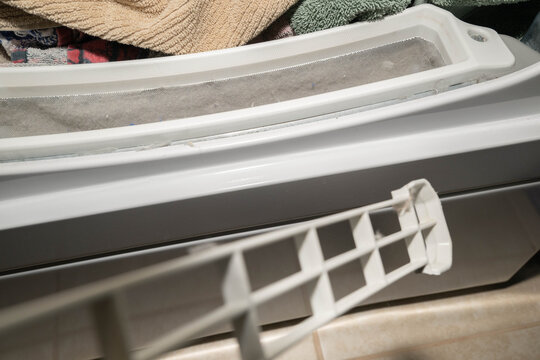 Used, dirty, dryer lint screen, filter, trap after drying a load of towels.