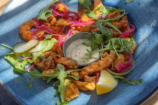 Delicious Dish Served With Sauce in a Blue Bowl
