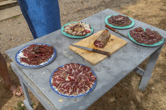 Meat Preparation on a Table Outdoors