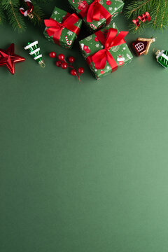Green Christmas and Happy New Year holiday background with gift boxes, red ribbon bows and festive red ornaments, flat lay with copy space. Greeting card.