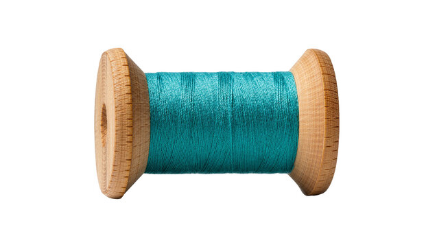 Teal sewing thread wound on a vintage wooden spool