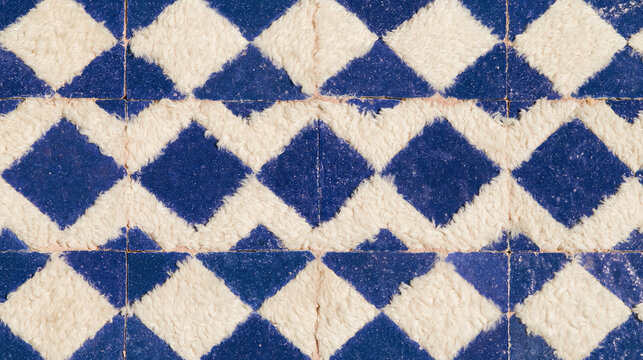 Deep blue Moroccan tile pattern, white diamond motifs and textured surface create traditional geometric design