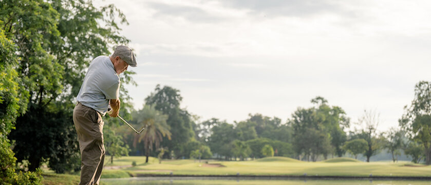 Professinal golf player on golf course. Pro golfer taking a shot. sport, golf, golfer, golfing, club,	