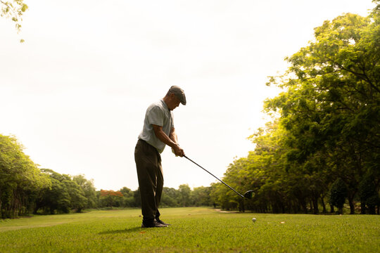 Professinal golf player on golf course. Pro golfer taking a shot. sport, golf, golfer, golfing, club,	