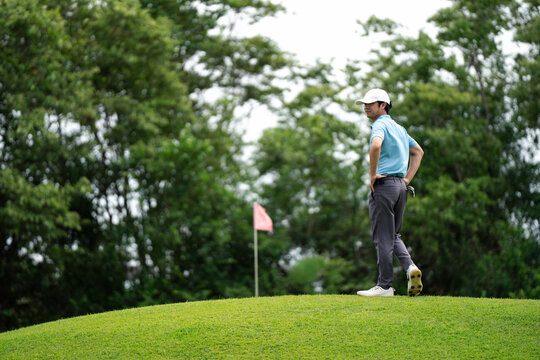 Professinal golf player on golf course. Pro golfer taking a shot. sport, golf, golfer, golfing, club,	