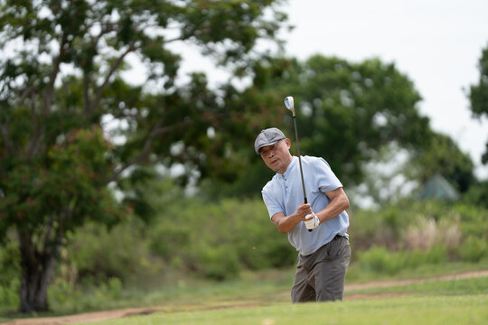 Professinal golf player on golf course. Pro golfer taking a shot. sport, golf, golfer, golfing, club,	