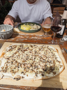 Traditional tarte flamb&eacute;e served at restaurant in Alsace, France