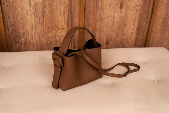 Leather brown bag placed on a sofa