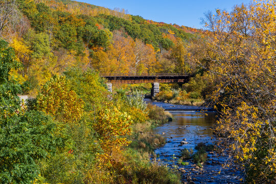 Hoosic River flowing under a railroad bridge