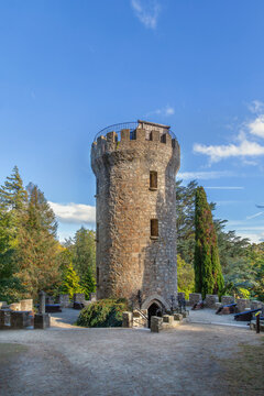 Scenic view of Pepperpot Tower in Powerscourt gardens, Ireland. Unique historic stone architecture stands out under a blue sky