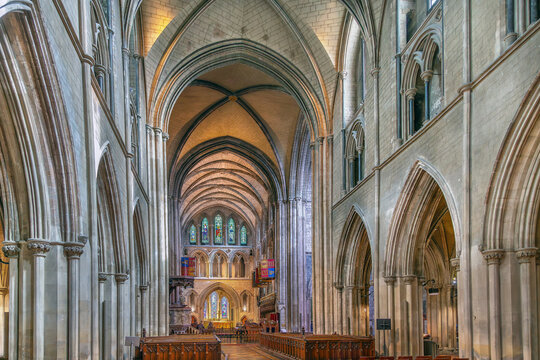 Interior view of St. Patrick's Cathedral in Dublin, Ireland. Magnificent medieval gothic architecture is lit by soft light