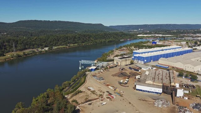 Drone aerial of downtown city of Chattanooga Tennessee in United States with roads, buildings, museums, and attractions along highway and with Choo Choo signage on top building rooftops in moving shot