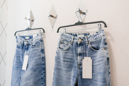Denim Jeans Hanging Inside Store Fitting Room Area