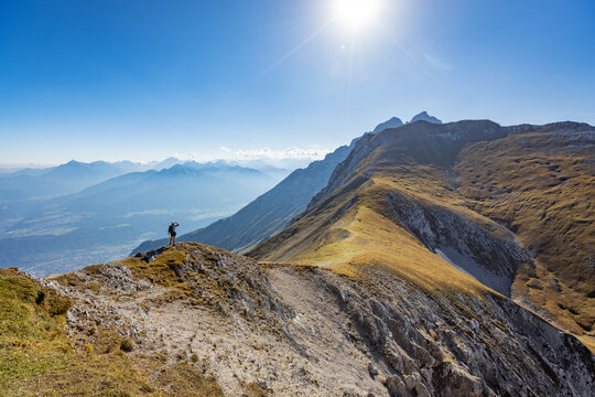 Panoramic Alpine Mountain Peaks with a Climber on a Via Ferrata