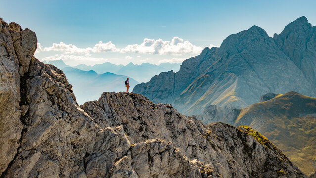 Panoramic Alpine Mountain Peaks with a Climber on a Via Ferrata