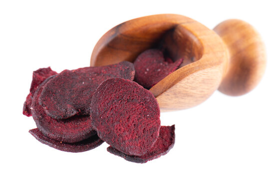 Crispy roasted beetroot chips with sea salt, isolated on white background. Healthy and crunchy natural vegetable snack. Clipping path.