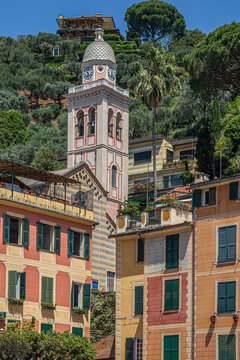 Portofino, Italy, on the Ligurian coast, showcasing colorful traditional houses and the bell tower of Chiesa di San Giorgio-Divo Martino.