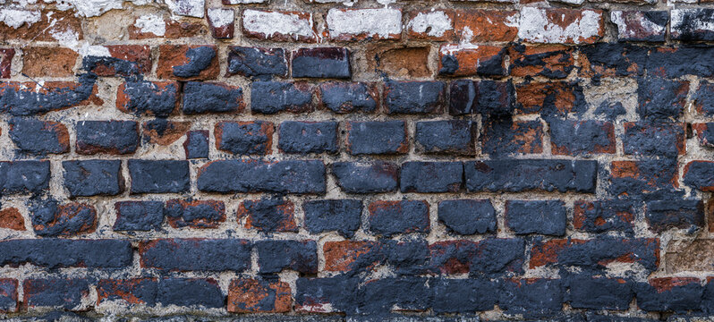 Panoramic brick wall texture, dark blue painted historic masonry, grunge backdrop