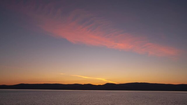 Amazing sea landscape. Dramatic sky and shining golden waves. Summer sunset seascape. Tourism, travel, holiday concept. 