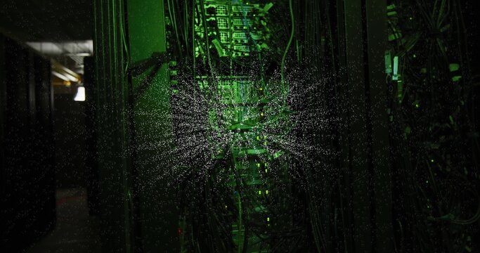 Illuminating central rack showing switches, patch panels, cables and radial dust in data center