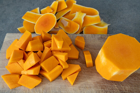 Stockholm, Sweden Chopped Butternut squash on a wooden board.
