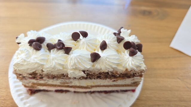 Chocolate Cake Decorated with Rich Chocolate Ganache and Creamy Frosting on a Beautiful Dessert Plate. cake with chocolate