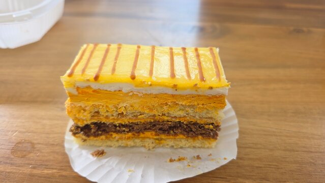 piece of cake on a plate. piece of cake on a white plate