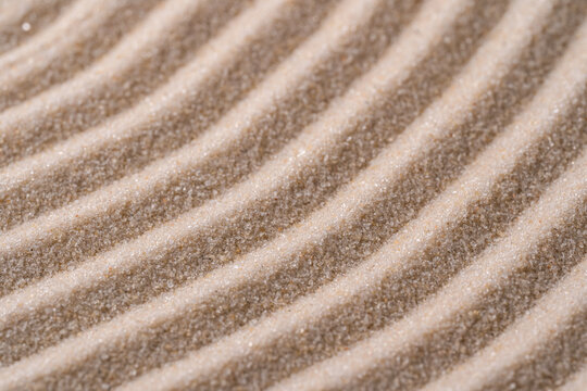 Zen meditation sand pattern with calm rippled texture