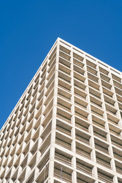 Concrete building frame against clear blue sky