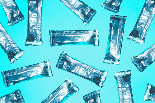 Silver protein bar package pattern on turquoise background