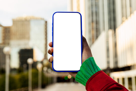 Gen-Z Black woman holding smartphone with blank screen