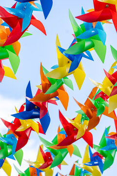 Colorful pinwheel decoration against blue sky